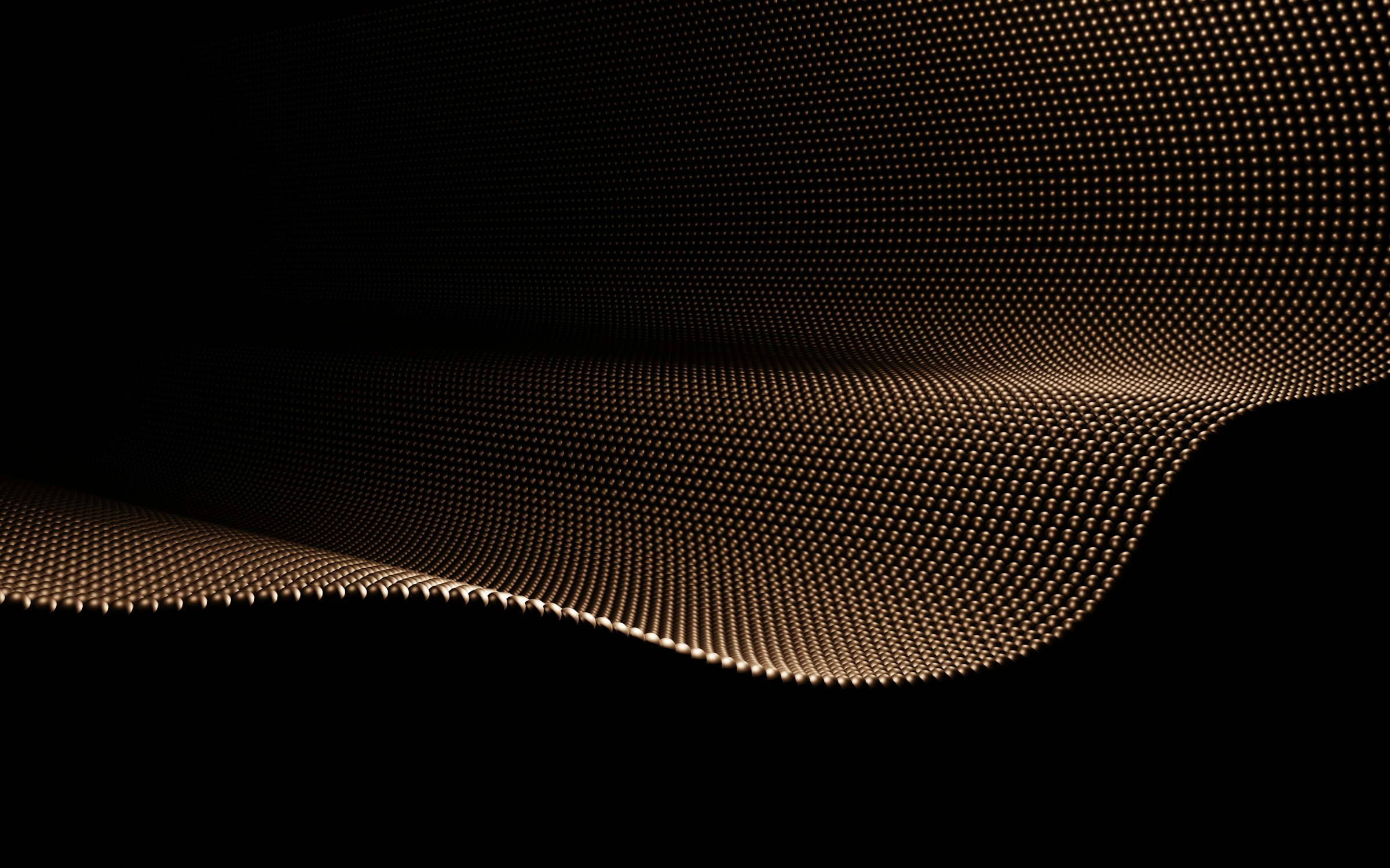 A flowing wave of gold particles against black, suggesting order emerging from many parts